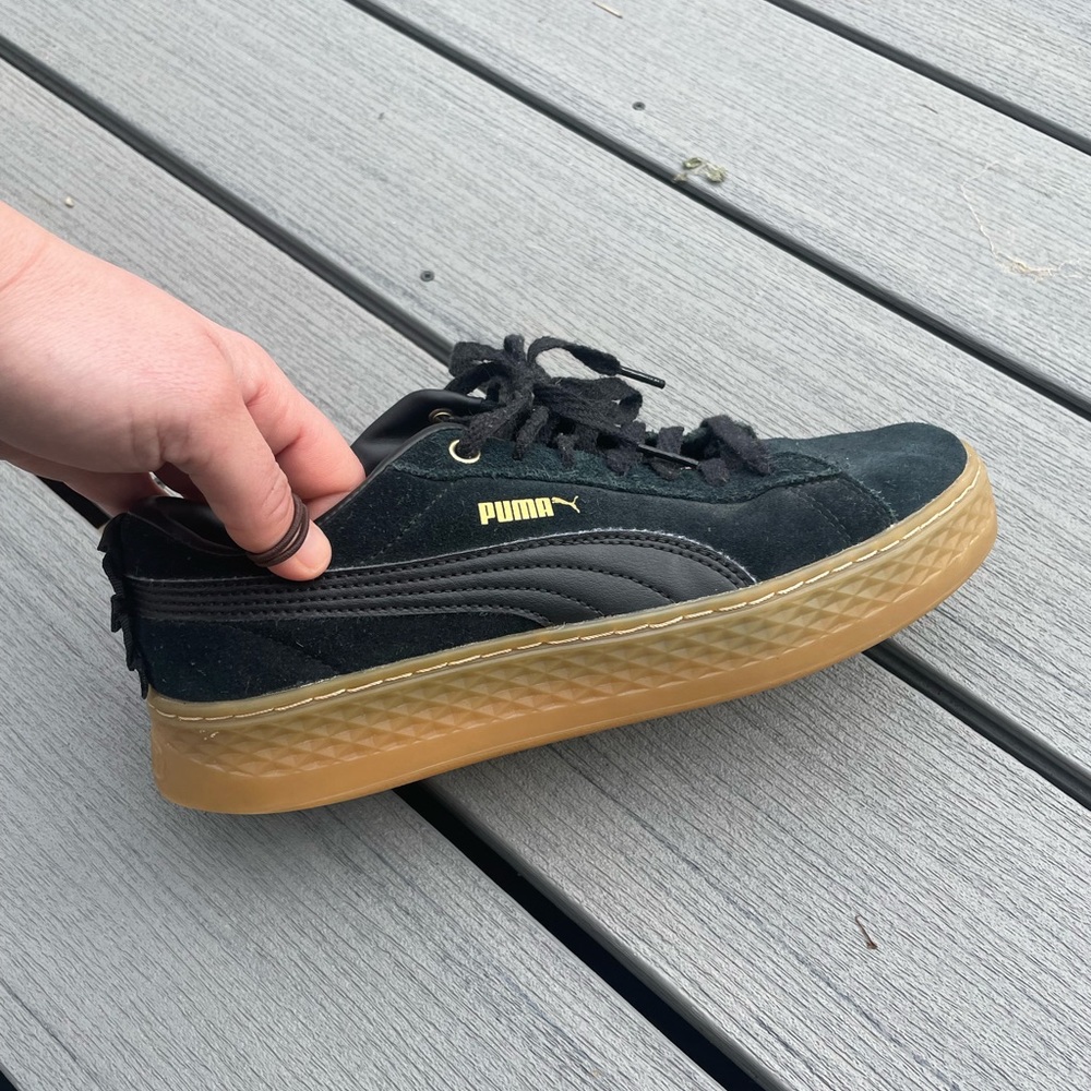 PUMA black suede platform creepers with gum sole.